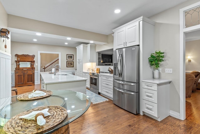 1244 Salem Rd, Havana, FL 32333 - kitchen featuring sink, a center island with sink, dark hardwood / wood-style floors, stainless steel appliances, and white cabinets