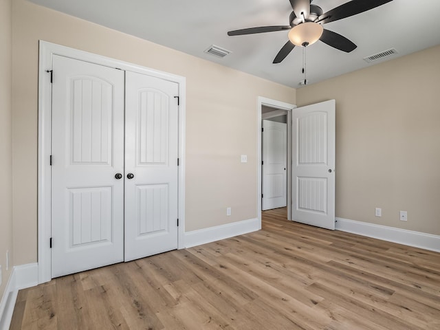 42 Duane Dr, Crawfordville, FL 32327 - unfurnished bedroom featuring light wood finished floors, a closet, and a ceiling fan