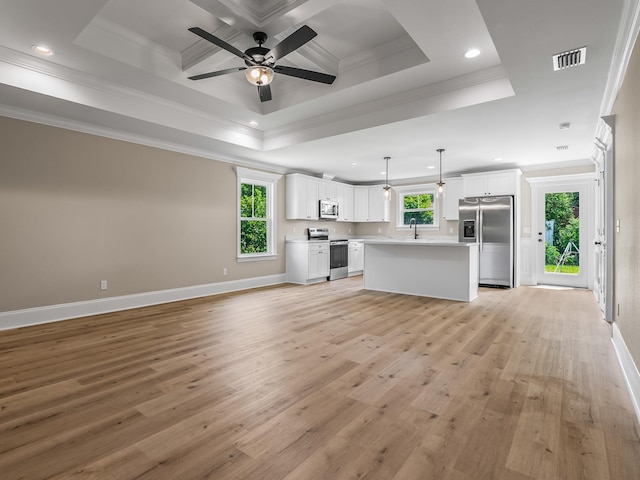 42 Duane Dr, Crawfordville, FL 32327 - kitchen featuring stainless steel appliances, open floor plan, ornamental molding, ceiling fan, and light wood-style flooring