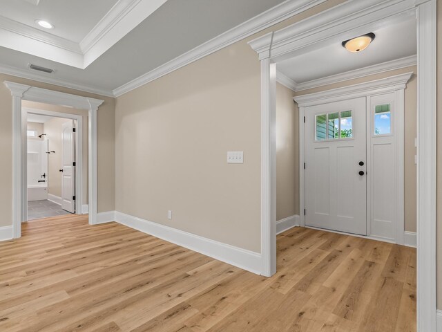 42 Duane Dr, Crawfordville, FL 32327 - entryway featuring ornate columns, light wood-style floors, and ornamental molding