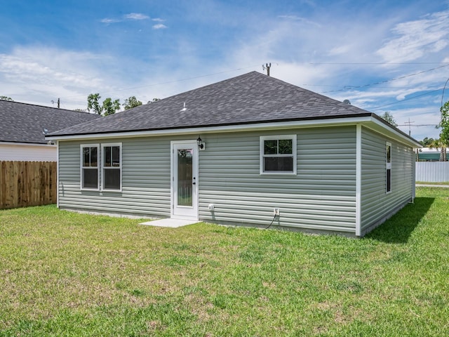 42 Duane Dr, Crawfordville, FL 32327 - rear view of house featuring roof with shingles