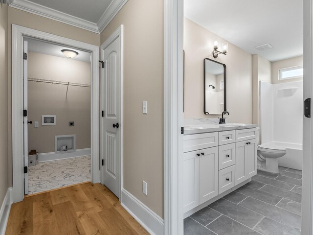 42 Duane Dr, Crawfordville, FL 32327 - full bathroom featuring vanity, ornamental molding, and wood finished floors