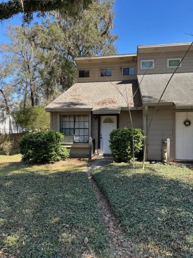 1207 Brafforton Dr Unit A, Tallahassee, FL 32311 - view of front of property with a front yard and a shingled roof