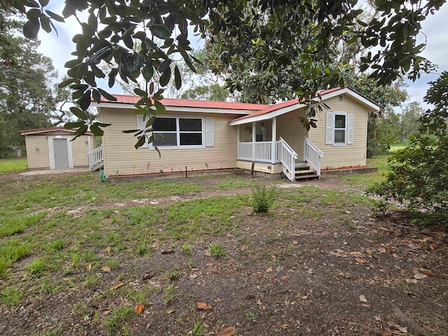 view of front facade featuring a shed