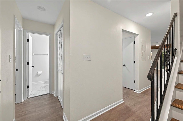 1138 Cherry Laurel St, Tallahassee, FL 32308 - hallway with wood finished floors, baseboards, electric panel, and stairs