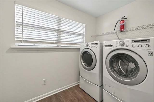 1138 Cherry Laurel St, Tallahassee, FL 32308 - washroom with washing machine and clothes dryer, dark wood-type flooring, and plenty of natural light