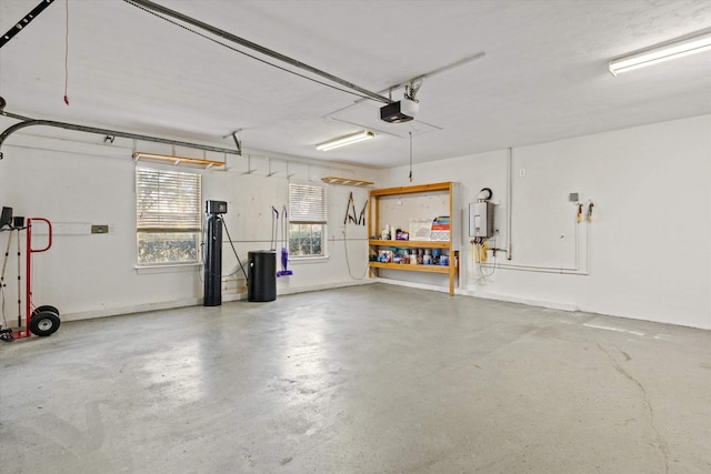 garage featuring a garage door opener and water heater