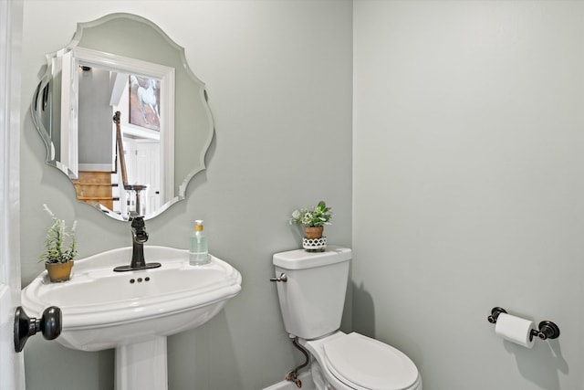 bathroom featuring sink and toilet