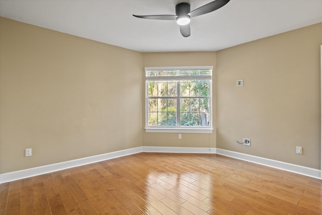 spare room featuring ceiling fan and light hardwood / wood-style flooring