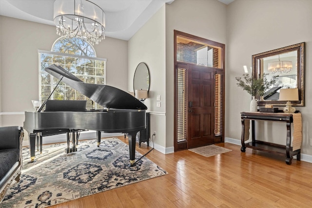 entrance foyer featuring a chandelier and light hardwood / wood-style flooring