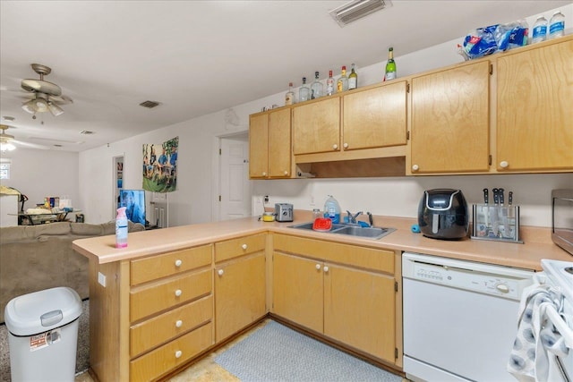 615621 N Woodward Ave -, Unit Tallahassee, FL 32304 - kitchen with white dishwasher, a ceiling fan, a peninsula, light countertops, and open floor plan