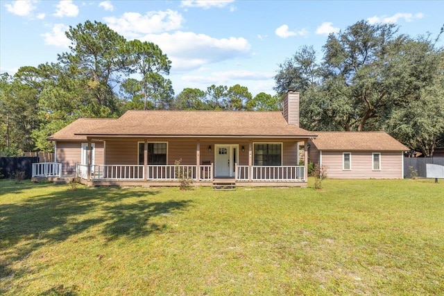 ranch-style house with a front lawn and covered porch