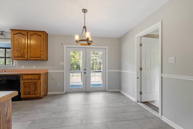 kitchen with hanging light fixtures, french doors, plenty of natural light, and dishwasher