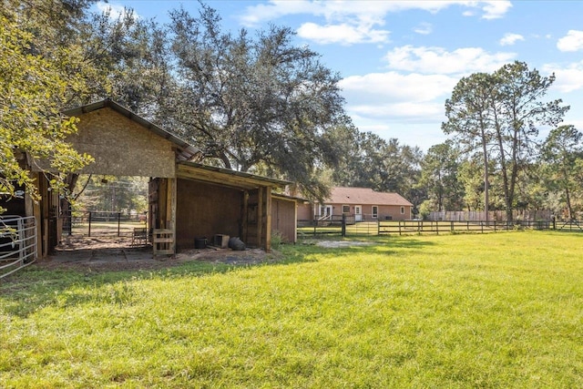 view of yard with an outdoor structure