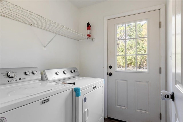 laundry area with washing machine and dryer