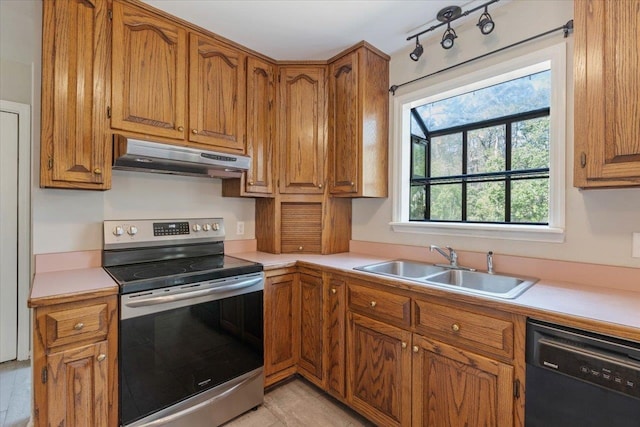 kitchen featuring sink, stainless steel electric range oven, and dishwasher