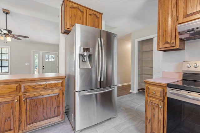 kitchen with ventilation hood, ceiling fan, and appliances with stainless steel finishes