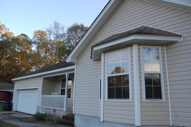 view of side of property featuring a garage