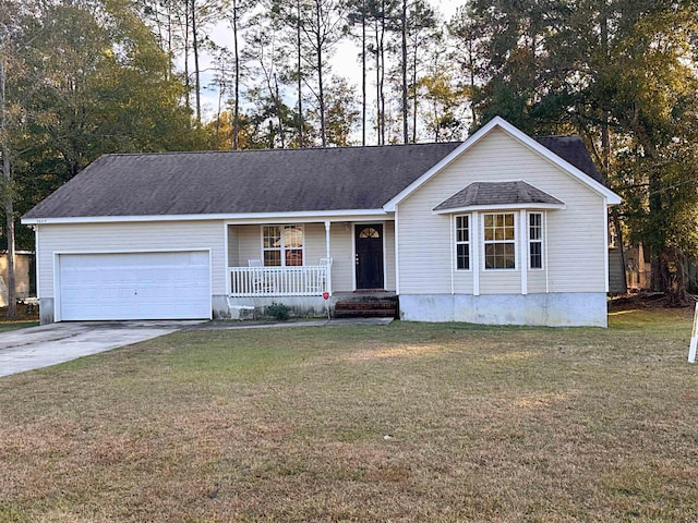 ranch-style home featuring covered porch, a garage, and a front lawn