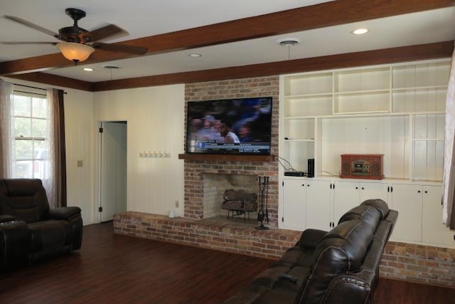 915 Hillcrest Ave, Quincy, FL 32351 - living room featuring beam ceiling, wood finished floors, ceiling fan, and a brick fireplace