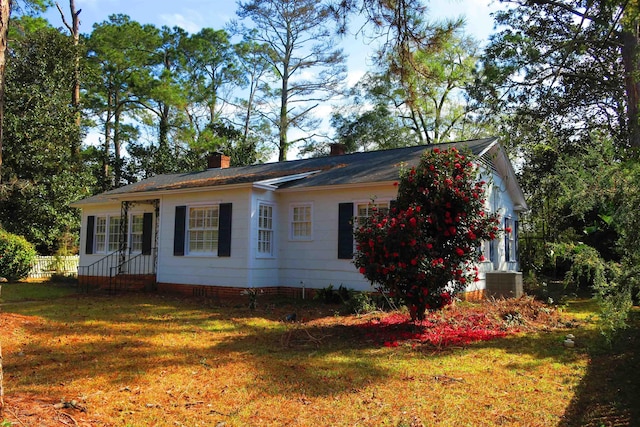 915 Hillcrest Ave, Quincy, FL 32351 - view of side of property featuring a chimney, a lawn, and central air condition unit
