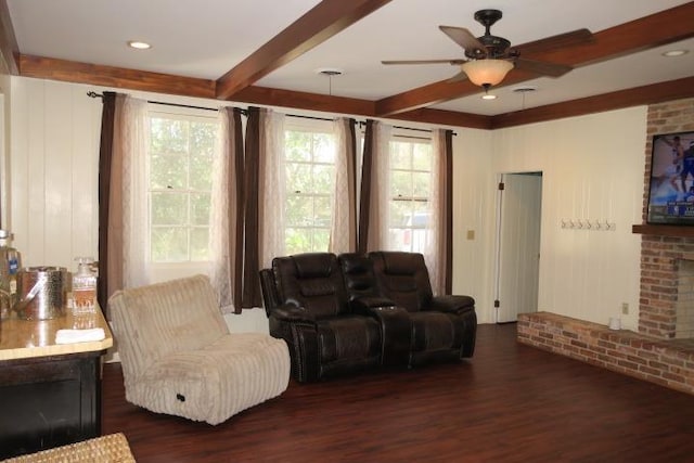 915 Hillcrest Ave, Quincy, FL 32351 - living room featuring a fireplace, beamed ceiling, dark wood-style flooring, and ceiling fan