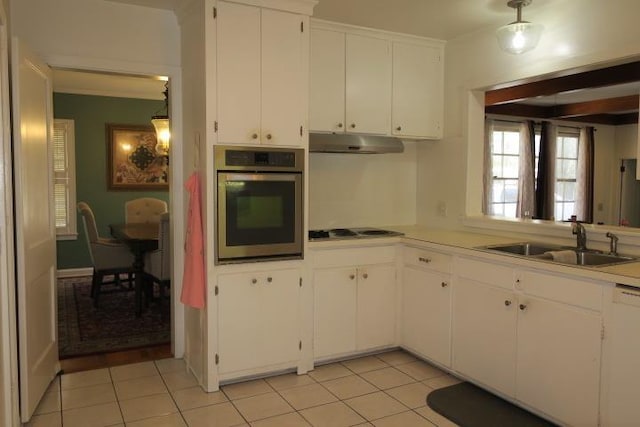 915 Hillcrest Ave, Quincy, FL 32351 - kitchen with oven, a sink, under cabinet range hood, cooktop, and white cabinetry