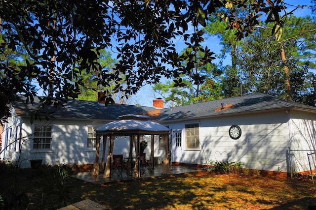 915 Hillcrest Ave, Quincy, FL 32351 - back of house featuring a gazebo, a patio, and a chimney