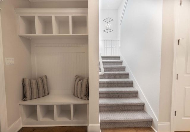 mudroom with an inviting chandelier