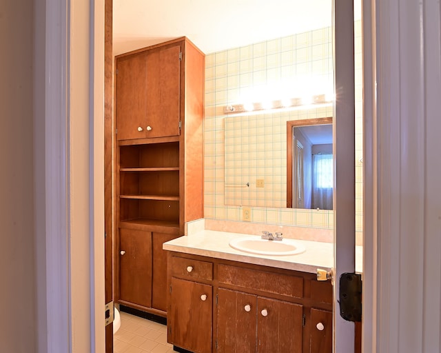 bathroom featuring tile patterned flooring and vanity