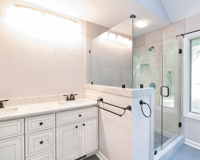 bathroom featuring vanity, tile patterned floors, an enclosed shower, and lofted ceiling