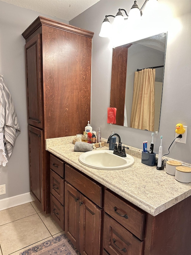 full bathroom with tile patterned flooring and vanity