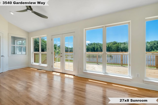 unfurnished sunroom featuring a wealth of natural light, french doors, vaulted ceiling, and ceiling fan