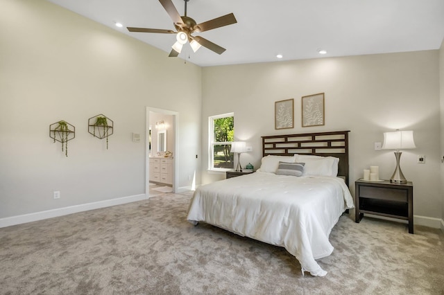 carpeted bedroom featuring ceiling fan, connected bathroom, and high vaulted ceiling