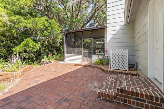 view of patio / terrace with a sunroom