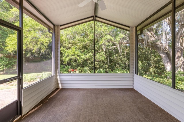 unfurnished sunroom featuring ceiling fan