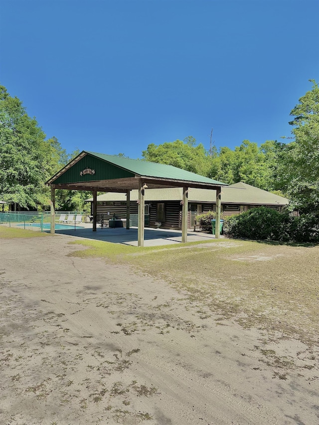 view of home's community featuring fence and a gazebo