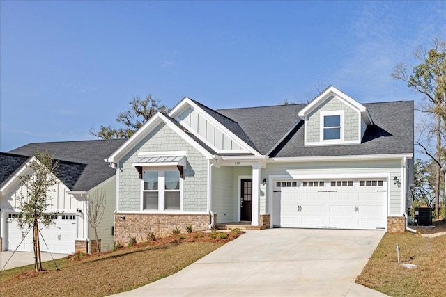 craftsman-style house featuring a garage and central AC