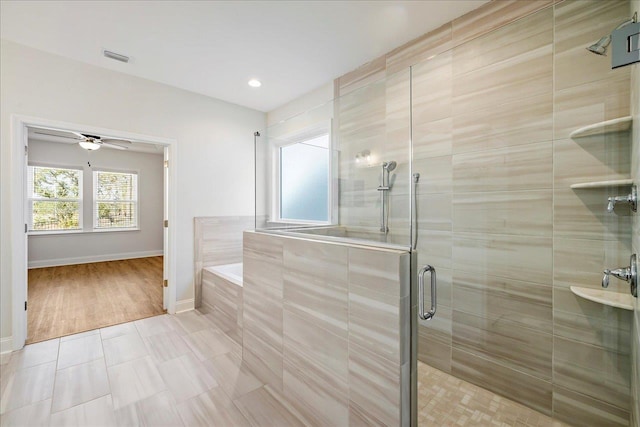 bathroom with separate shower and tub and tile patterned flooring