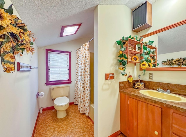 full bathroom with lofted ceiling with skylight, vanity, a textured ceiling, and toilet