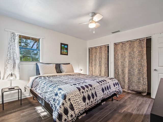 bedroom featuring dark hardwood / wood-style floors and ceiling fan