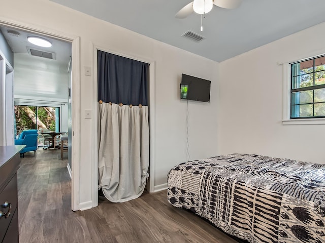 bedroom featuring ceiling fan and dark wood-type flooring