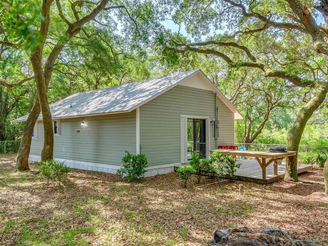 view of side of property with a deck