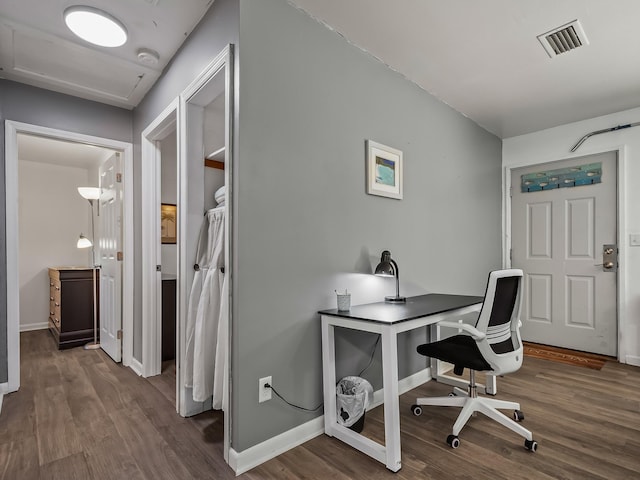 office space with dark hardwood / wood-style flooring