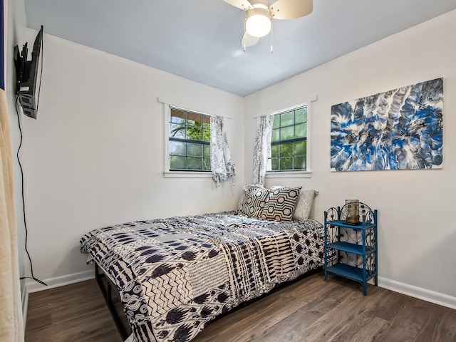 bedroom featuring ceiling fan and dark hardwood / wood-style floors