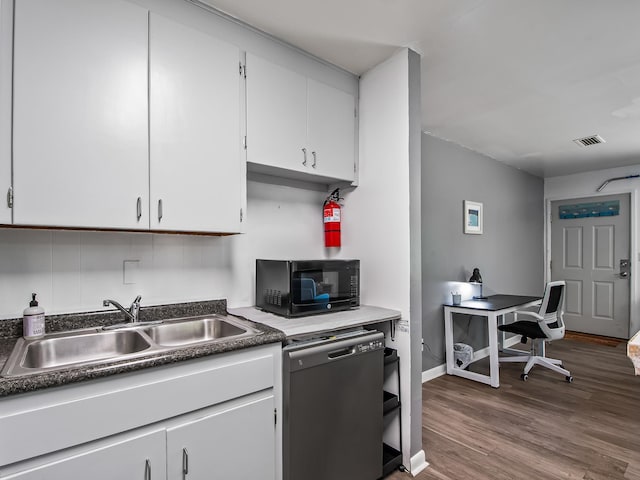 kitchen featuring white cabinetry, dishwasher, hardwood / wood-style floors, and sink