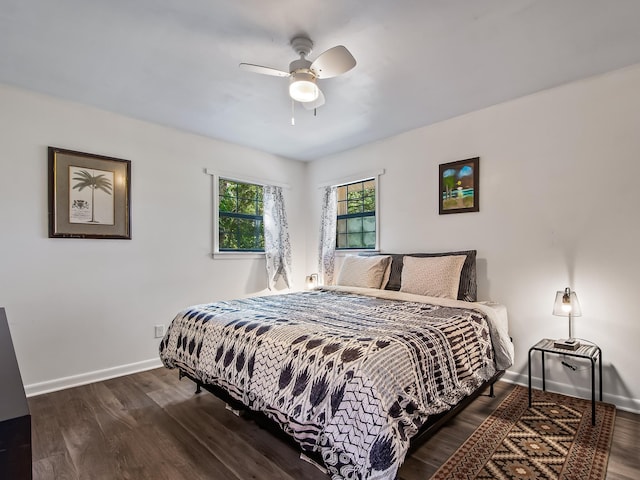 bedroom featuring ceiling fan and dark hardwood / wood-style flooring