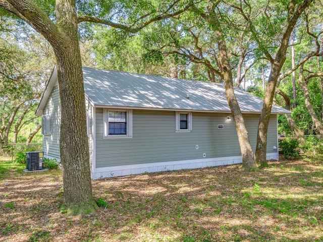 view of side of property featuring central AC unit