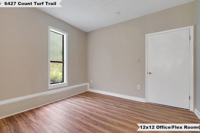 6427 Count Turf Trl, Tallahassee, FL 32309 - unfurnished room featuring wood finished floors and baseboards