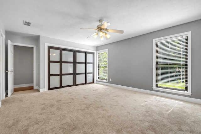 6427 Count Turf Trl, Tallahassee, FL 32309 - unfurnished bedroom featuring baseboards, carpet floors, and ceiling fan